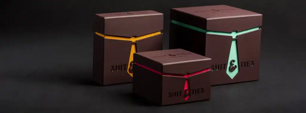 Three Chocolate Boxes With Decorative Ties Constructed From Rigid Materials Ideal For Presenting Sweet Confections